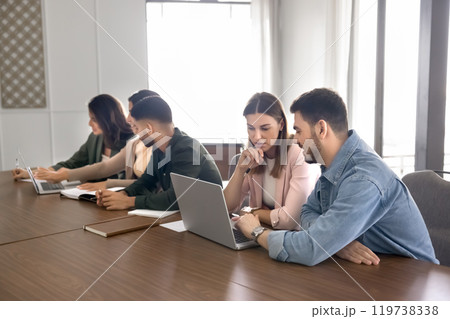 Young couple of business colleagues in casual working on project 119738338