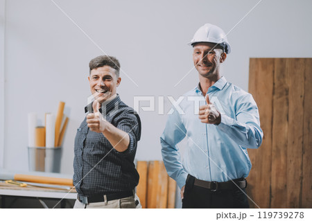 Team Engineers with draft plan of building on constructing site. Engineer work on site. engineer visit and inspection site engineer. Inspector engineer check and working on site. 119739278