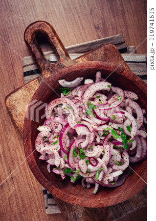 chopped red onion, with sumac and herbs, in a bowl, pickled Spanish onion, close-up, top view, 119741615