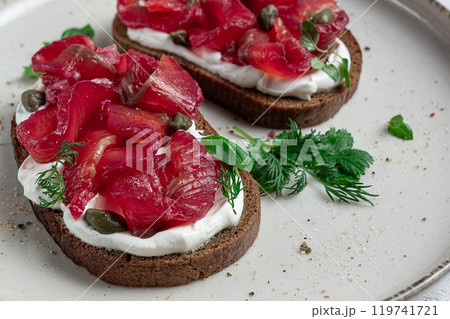 Sandwiches with gravlax salmon, cream cheese, capers, greens, breakfast, homemade, 119741721