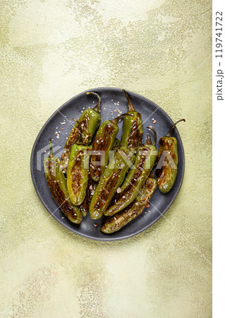fried padron pepper, in a frying pan, with olive oil, and sea salt, homemade, no people. 119741722
