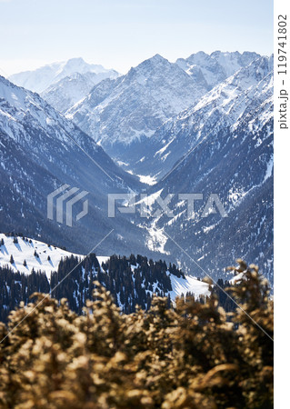 Vew from top of slope on snow capped mountains. Karakol ski resort in Kyrgyzstan 119741802