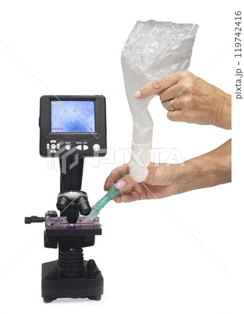 microscope and sperm in studio microscope and sperm in studio 119742416