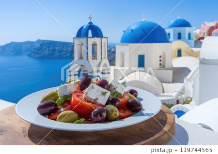 Greek salad overlooking the caldera in oia, santorini, greece Greek salad overlooking the caldera in oia, santorini, greece 119744565