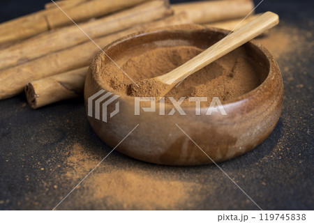 cinnamon tree bark with golden powder 119745838