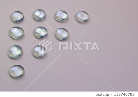 Glass drops on a colorful background with copy space, beautiful abstract texture with place for text Glass drops on a colorful background with copy space, beautiful abstract texture with place for text 119746708