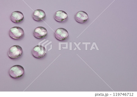 Glass drops on a colorful background with copy space, beautiful abstract texture with place for text 119746712