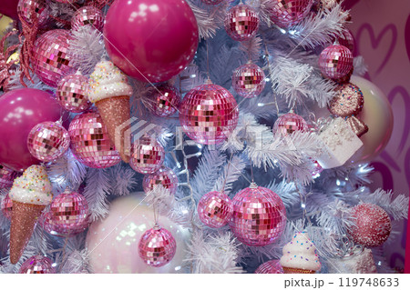 Shiny pink baubles and ice cream cones hanging on Shiny pink baubles and ice cream cones hanging on 119748633