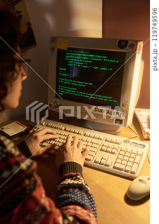 Programming on Desktop Computer During Night with Lamp Light Programming on Desktop Computer During Night with Lamp Light 119749596