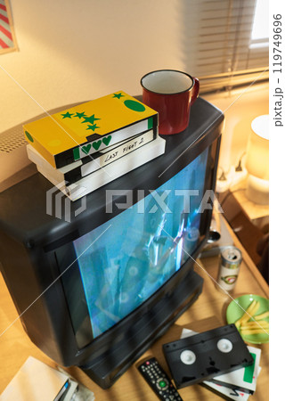 Stacked VHS Tapes on Vintage CRT Television Set Stacked VHS Tapes on Vintage CRT Television Set 119749696
