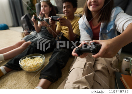 Group of Friends Playing Video Games and Enjoying Group of Friends Playing Video Games and Enjoying 119749785