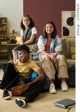 Diverse Group of Friends Sitting in Living Room Diverse Group of Friends Sitting in Living Room 119749818
