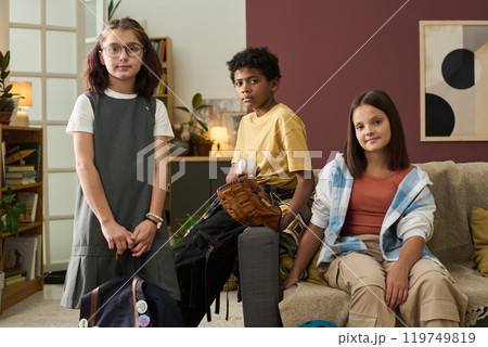 Portrait of Diverse Children Posing Inside Cozy Living Room Portrait of Diverse Children Posing Inside Cozy Living Room 119749819