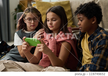 Group of Diverse Children Looking at Smartphone Together 119749832