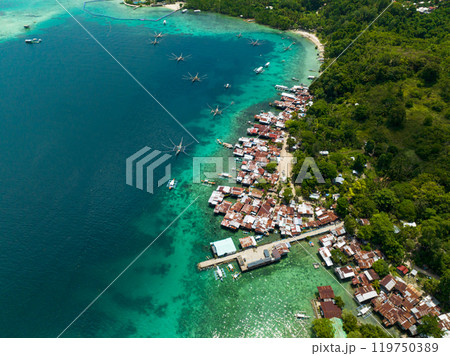 Samll villages over the turquoise water. Samal Island. Davao, Philippines. 119750389