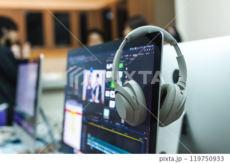 Headphone on computer at workplace office table. Audio digital equipment. Headphone on computer at workplace office table. Audio digital equipment. 119750933