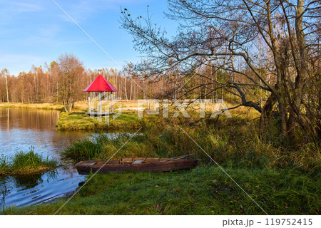 Tranquil Lakeside Gazebo with Red Roof in Autumn Tranquil Lakeside Gazebo with Red Roof in Autumn 119752415