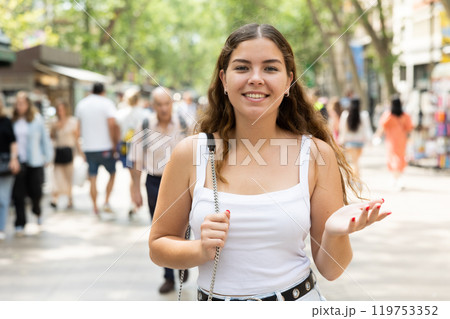 Cheerful girl enjoying walk along La Rambla in summer Barcelona Cheerful girl enjoying walk along La Rambla in summer Barcelona 119753352