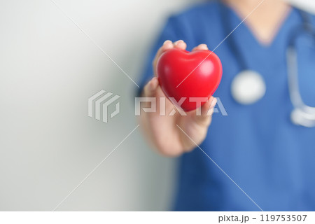 Doctor hand holding red heart shape in hospital. love, donor, world heart day, world health day, CSR donation and Insurance concepts 119753507