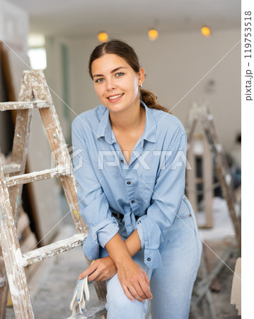 Portrat of cheerful young woman inside construction site 119753518
