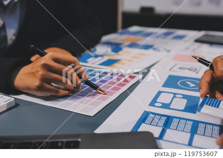 The designer team is designing the uxui system to make the uxui system work well on new phones and support system updates. Website development concept UI UX front end designer The designer team is designing the uxui system to make the uxui system work well on new phones and support system updates. Website development concept UI UX front end designer 119753607