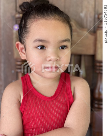 Portrait of cute little Asian girl with red tank top 119754593