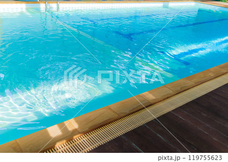 Side view of an indoor swimming pool without people, fitness activity concept. 119755623