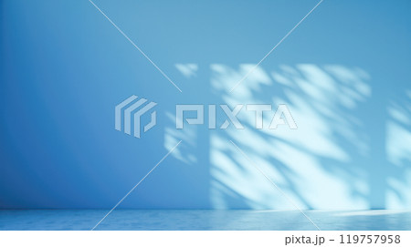 Bright, empty blue space with soft sunlight creating playful abstract shadows on smooth walls. Minimalist room design for showcasing products, art, or presentations. Calm, clean background 119757958