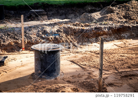 Sewer well and pipes, underground communications. Street repair 119758291