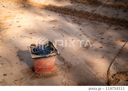Installation of a drain in the middle of the road, street reconstruction works 119758311