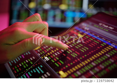 Analyzing Financial Data on Digital Tablet Screen Analyzing Financial Data on Digital Tablet Screen 119758642