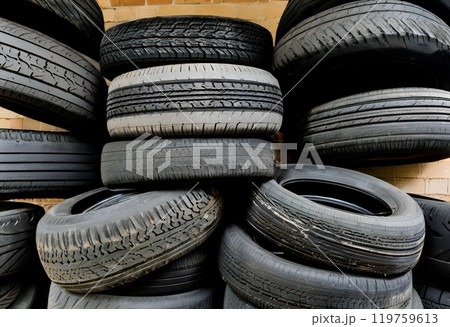 Old tires stacked, awaiting destruction or recycling for reuse.AI Generated 119759613