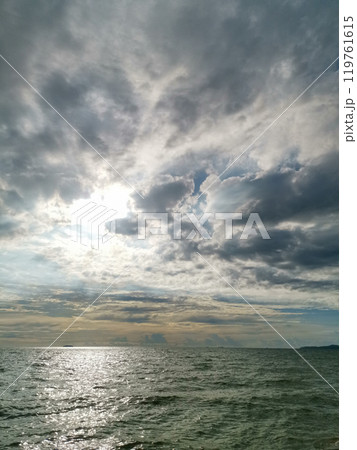 The sky is cloudy and the sun is shining through the clouds The sky is cloudy and the sun is shining through the clouds 119761615