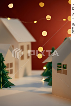 Template image with Christmas product display space, showcasing white paper houses placed side by side, next to green paper pines under the LED string lights, on the red background. 119764937
