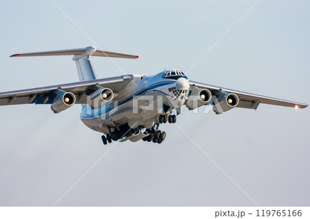 Taking off of the wide body cargo transport airplane and retracting the landing gear Taking off of the wide body cargo transport airplane and retracting the landing gear 119765166