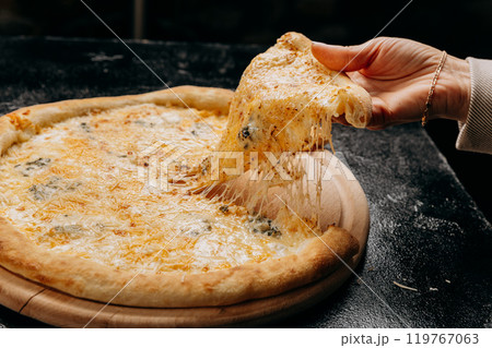 Melting cheesy pizza slice being lifted, showcasing gooey cheese pull, perfect for pizza lovers Melting cheesy pizza slice being lifted, showcasing gooey cheese pull, perfect for pizza lovers 119767063