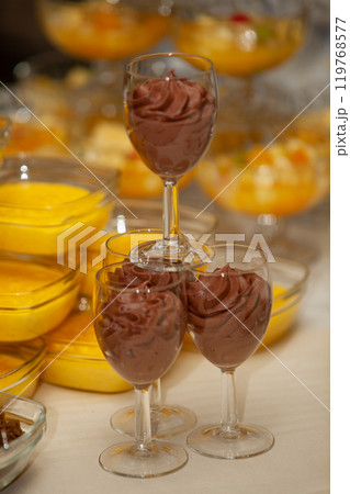 Indulge in a Luxurious and Elegant Chocolate Mousse Presented in Glasses for Dessert Display Indulge in a Luxurious and Elegant Chocolate Mousse Presented in Glasses for Dessert Display 119768577