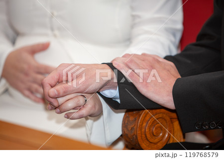 A Symbolic Wedding Ceremony Celebrating Love and Commitment Through Joined Hands and Hearts A Symbolic Wedding Ceremony Celebrating Love and Commitment Through Joined Hands and Hearts 119768579