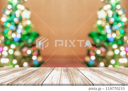 Empty wood table top with blur Christmas tree with bokeh light background 119770233