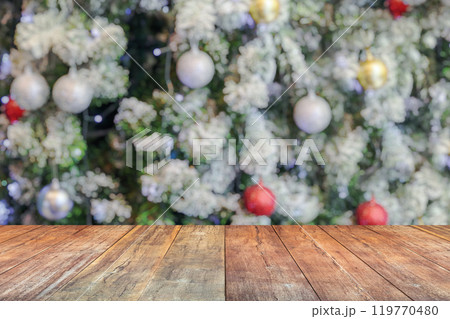 Empty wood table top with blur Christmas tree with bokeh light background 119770480