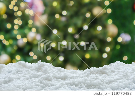Empty white snow with blur Christmas tree with bokeh light background Empty white snow with blur Christmas tree with bokeh light background 119770488