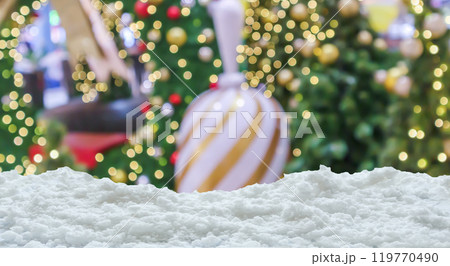 Empty white snow with blur Christmas tree with bokeh light background Empty white snow with blur Christmas tree with bokeh light background 119770490