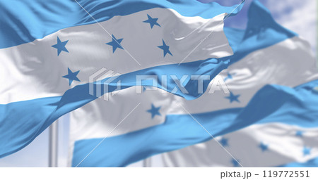 Flags of Honduras waving against a clear sky Flags of Honduras waving against a clear sky 119772551