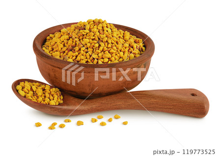 Bee pollen grains in ceramic bowl and spoon isolated on white background Bee pollen grains in ceramic bowl and spoon isolated on white background 119773525