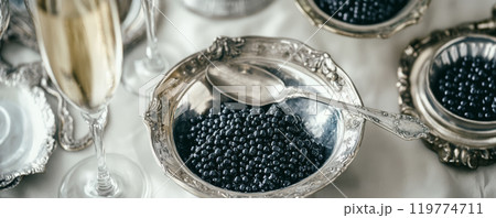 Black Caviar and Champagne on Elegant Table Setting 119774711