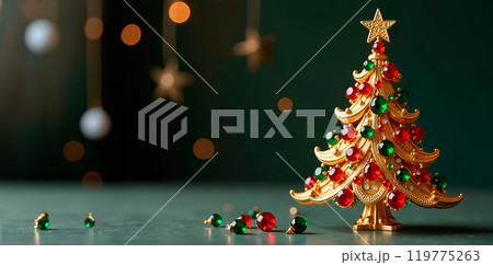 Christmas tree made of gold, decorated with green and red gemstones. Banner with copy space Christmas tree made of gold, decorated with green and red gemstones. Banner with copy space 119775263