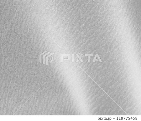 Glossy silver background with a smooth, wavy texture, evoking the elegance of stainless steel and 119775459