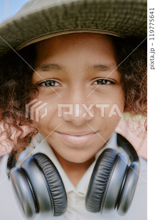 Vertical portrait of mixed race teen boy looking directly at camera Vertical portrait of mixed race teen boy looking directly at camera 119775641
