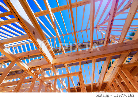 Building new home using timber trusses framed with joints in roofing Building new home using timber trusses framed with joints in roofing 119776162