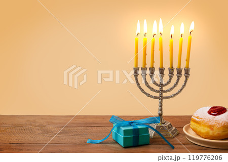 Hanukkah Menorah, candles and sufganiyah jelly donuts 119776206